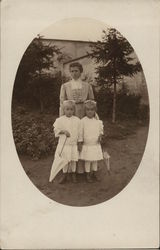 A Woman With Two Small Girls A Woman With Two Small Girls
