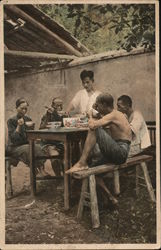 While Eating - Meal in courtyard Postcard