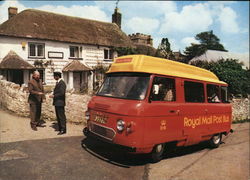 The Honiton Royal Mail Post Bus shown here at Dunkeswell Post Office. Postcard