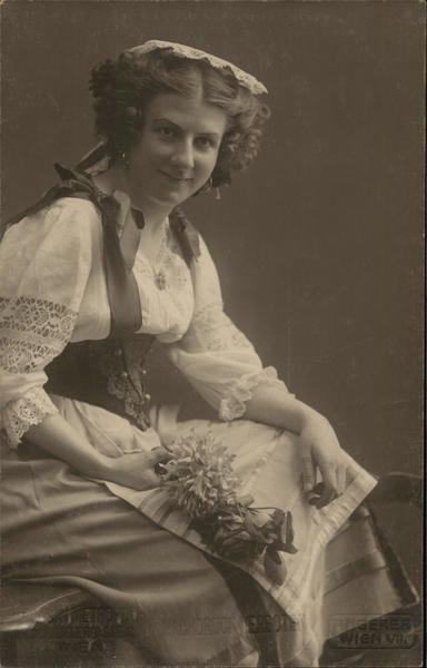 Woman with Curly Hair Holding Flower Bunch Women