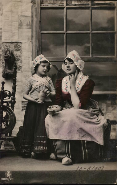 Girl Holding Teapot Standing Near Woman with Tea Cup