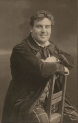 Man seated in chair Postcard