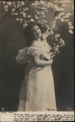 Woman Posed Holding Tree Blossoms Postcard