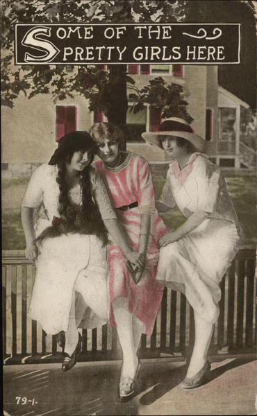 Three Ladies Sit On a Fence Railing Women