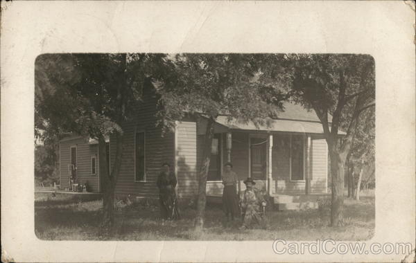 Family Posing In Front of Home Anthony Kansas