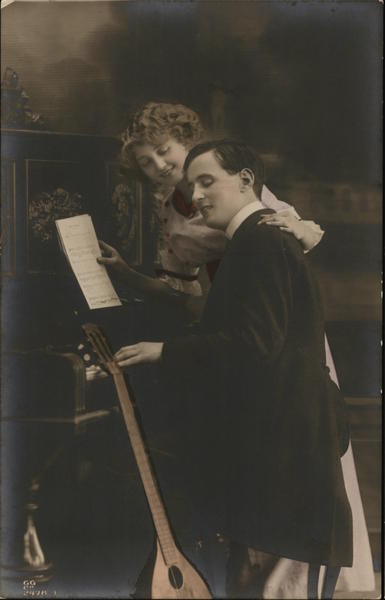 Man and Woman at Piano Pianos