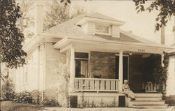 Man on Front Porch of Home Postcard