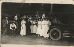 Women In White Posing by Cars Women In White Posing by Cars