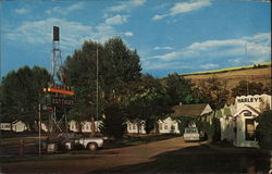 Harley's Cottages Motel Postcard