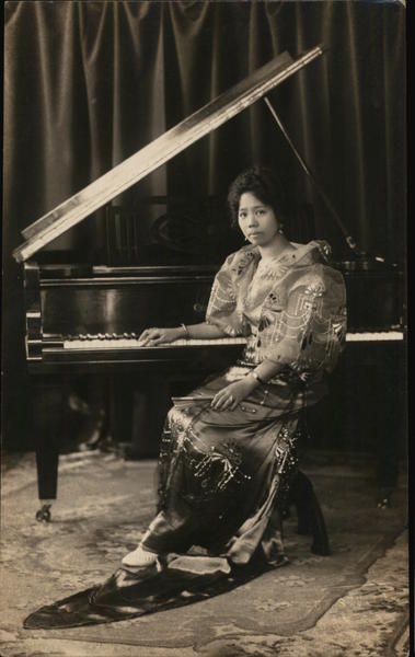 Philippine Woman Seated at a Piano Pianos