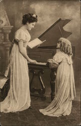 Woman plays piano as child looks on Woman plays piano as child looks on