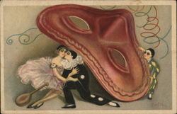 Man kisses woman under giant mask Man kisses woman under giant mask