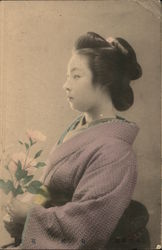Sideshot of Geisha Holding Flowers Japan Asian Postcard Postcard