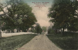 Main Street, Dr. Parks Residence in Foreground Postcard