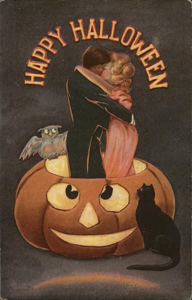 Happy Halloween - Man and woman kissing inside a pumpkin