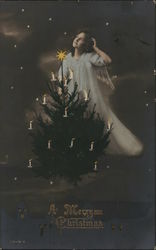 Angel and a Christmas Tree with Candles Angel and a Christmas Tree with Candles