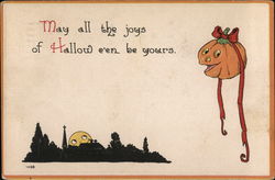 A jack o'lantern with a red bow on its stem with a Halloween greeting Postcard