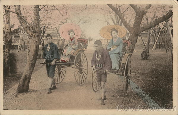 Japanese women being pulled in rickshaws