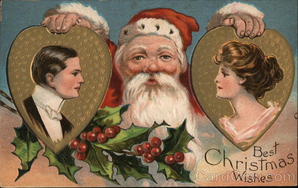 Santa hold shaped pictures of a man and a woman. Santa Claus