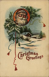 Christmas Greetings. Santa's face above a snow-capped cabin. Postcard