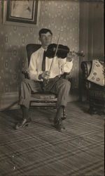 Man Playing Violin in Parlor Postcard