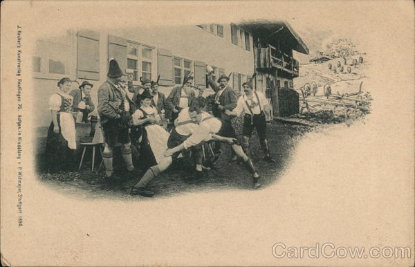 Men wrestling in front of onlookers Germany