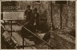 Kissing the Blarney Stone, Blarney Castle Co. Cork. Erected 15th century by Cormac Maccarthy Postcard