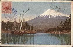 View of a snow covered mountain and river below Postcard