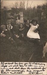Family Posing Outside Postcard