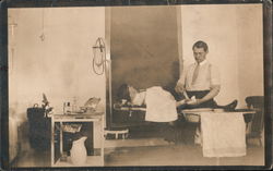Doctor Working on Patient Postcard