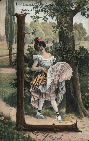 Young Woman on Path with Large L Tree Alphabet Letters