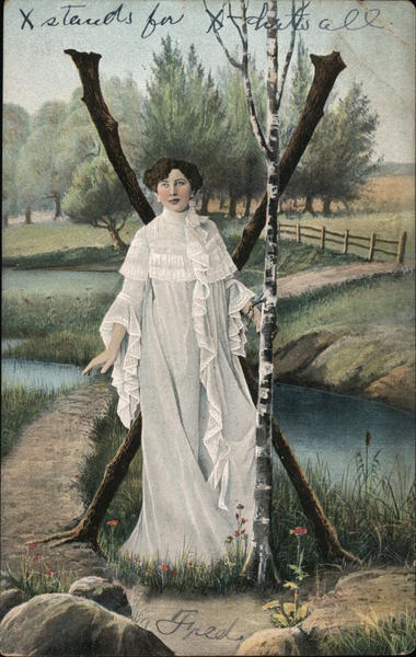 Woman standing in front of letter X Alphabet Letters