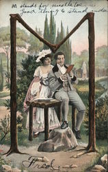 Couple sitting in the letter M Trees Postcard