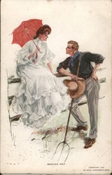 "Making Hay" -- Man and women speaking by fence Harrison Fisher Postcard