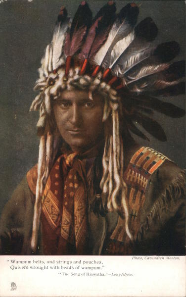 American Indian man wearing feathered headdress Native Americana