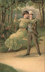 Man pushing woman on a swing Postcard