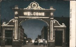 The Welcome Arch at Night Postcard