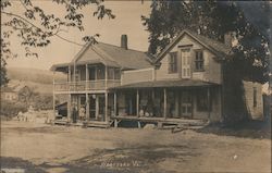 Two Children Standing in Front of General Store Postcard