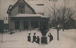 Family In Front of Home in Snow Postcard