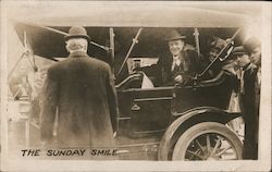 Smiling man seated in automobile: "The Sunday Smile" Postcard