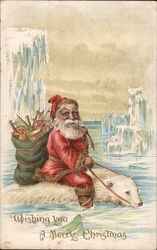 Santa riding a polar bear among icebergs Postcard