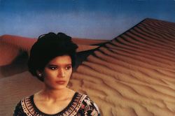 Woman in front of sand dunes Postcard