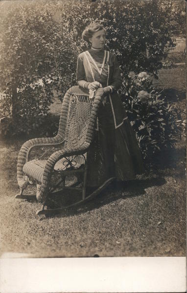 Woman Posing by Wicker Rocker Women