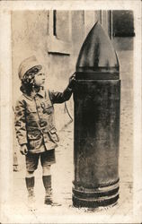 Child Standing by Huge Artillery Shell Postcard