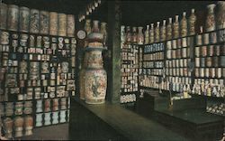 A room displaying various pottery ware Postcard