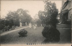 People walking in a garden Postcard