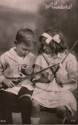 "Isn't it Wonderful?" -- A little boy & girl have their fishing rods & lines tangled Postcard