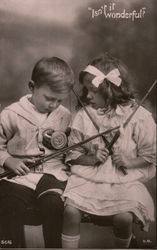 "Isn't it Wonderful?" -- A little boy & girl have their fishing rods & lines tangled Postcard Postcard Postcard