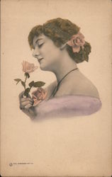 Portrait of Woman Smelling Rose Postcard