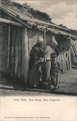 Indian woman and child with mortar and pestle Postcard
